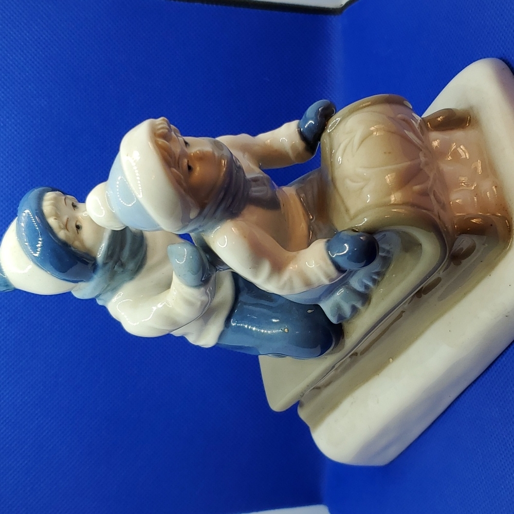 PAUL SEBASTIAN PORCELAIN CHILDREN ON SLED FIGURE